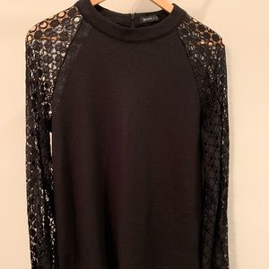 Miholl pullover top with lace long sleeves and zipper at back of neck. Size M